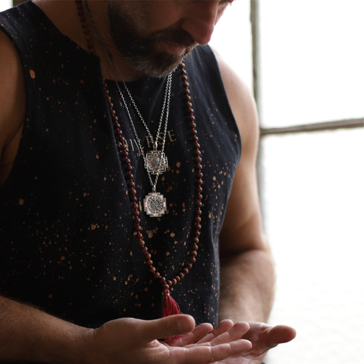 Yoga teacher Valentin from Leipzig wears the Buddha symbol pendant from the men's jewelry collection by ETERNAL BLISS