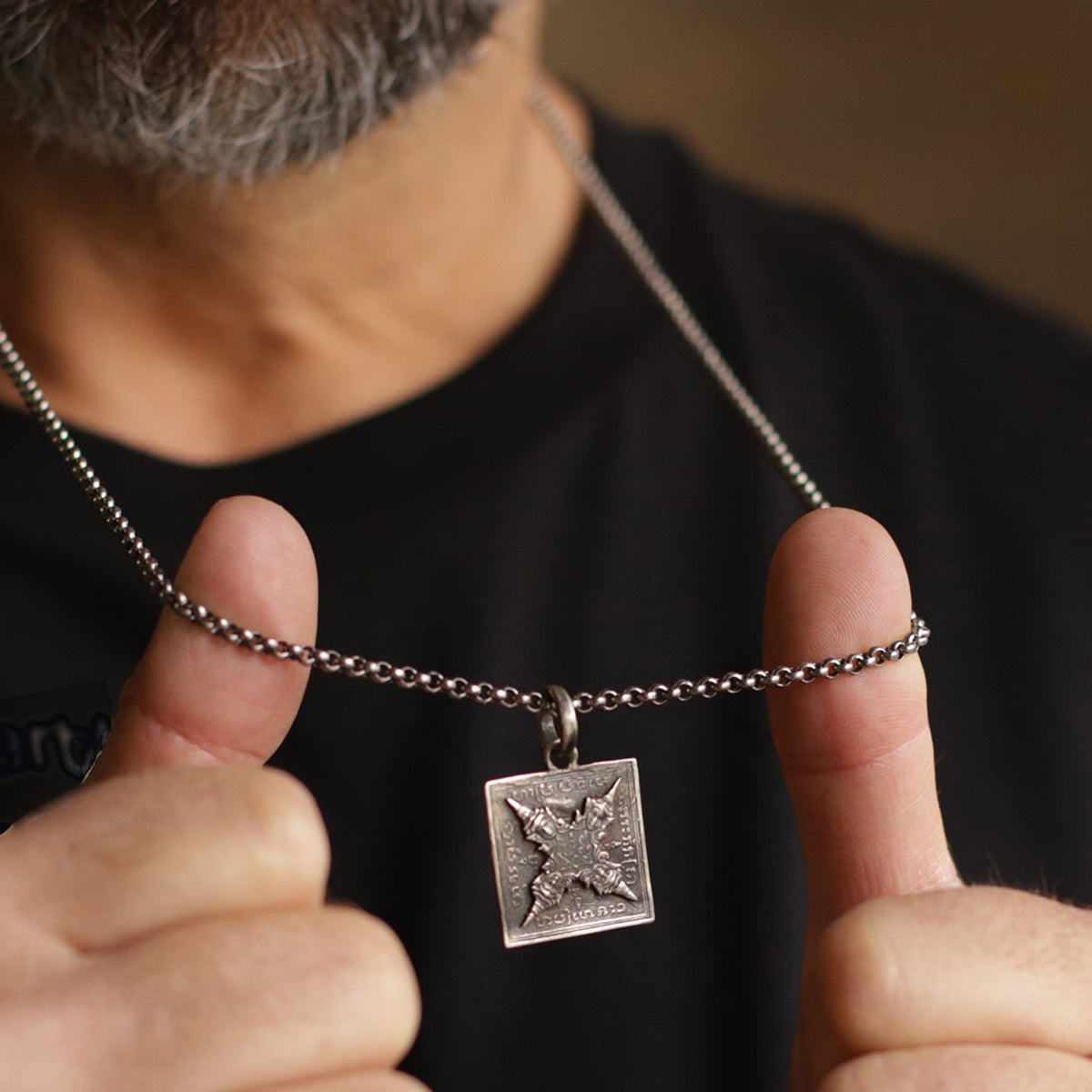 Yoga teacher Valentin from Leipzig wears the Buddha symbol pendant from the men's jewelry collection by ETERNAL BLISS