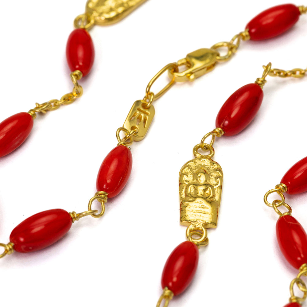 Ladakh gemstone necklace with coral beads and Buddha emblems made of high-quality gold-plated sterling silver by Eternal Bliss
