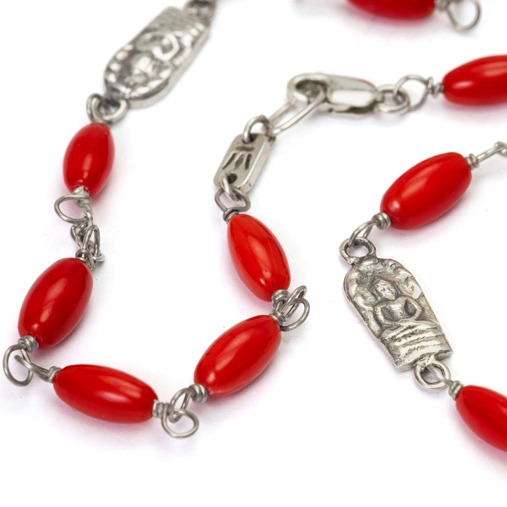 Gemstone necklace with coral beads and Buddha emblems made of high-quality sterling silver by Eternal Bliss