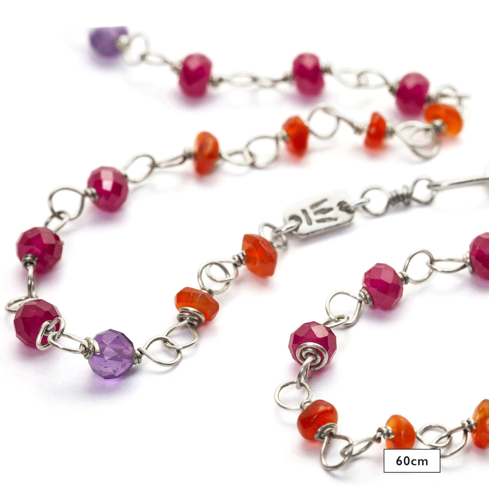 Detail of the 60cm gemstone necklace "Prana" made of high-quality sterling silver with rubies, carnelians, and amethyst by Eternal Bliss