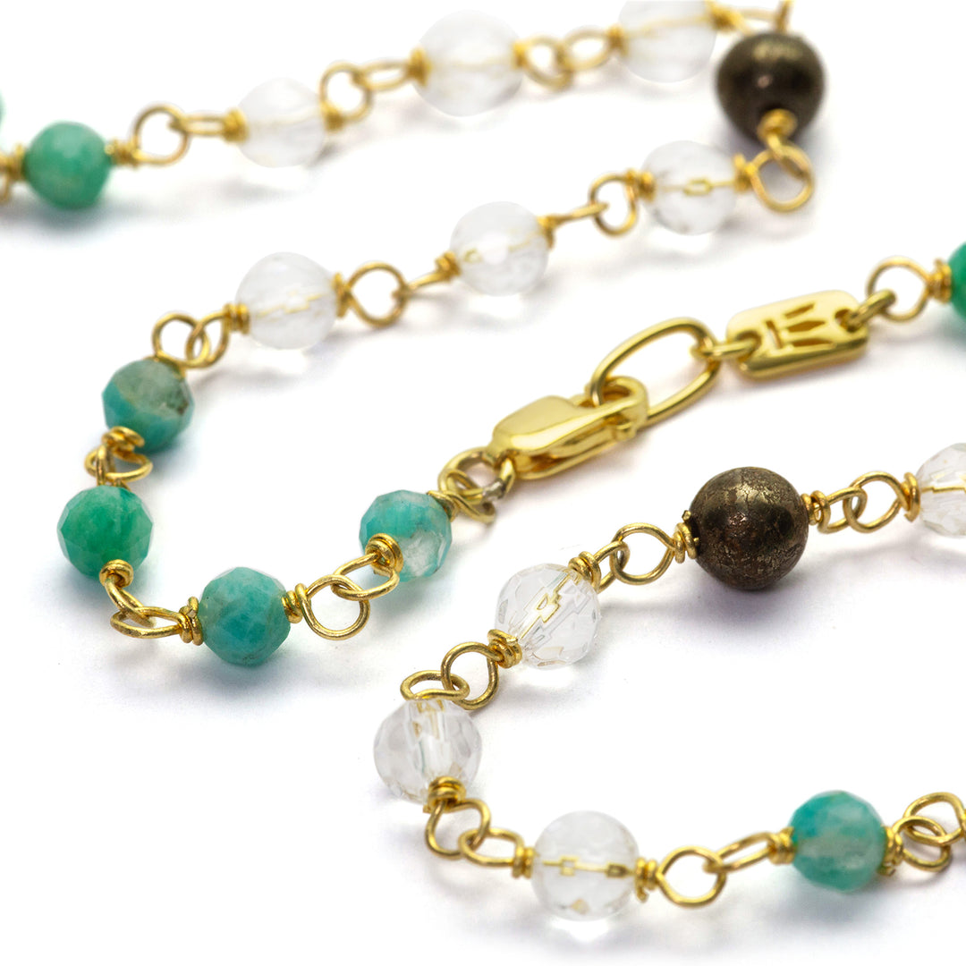 Detail of gemstone necklace "Jin Tao" made of high-quality gold-plated sterling silver with aquamarine, rock crystal and hematite by Eternal Bliss