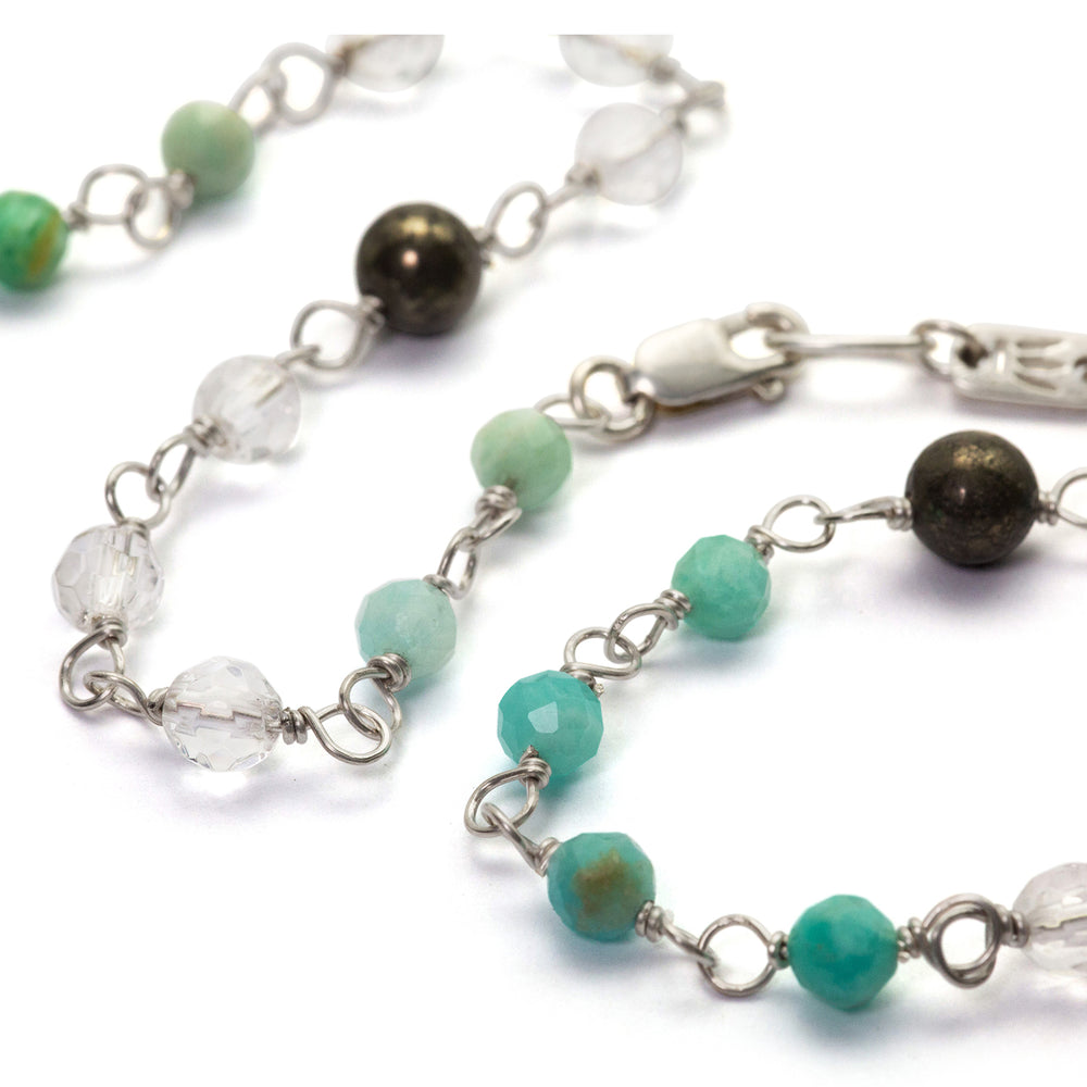 Detail of gemstone necklace "Jin Tao" made of sterling silver with aquamarine, rock crystal and hematite by Eternal Bliss