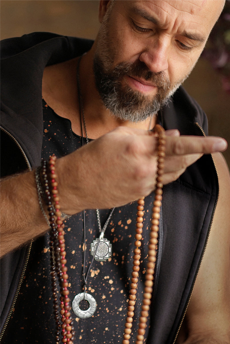 Valentin is wearing a Sri Yantra necklace from Eternal Bliss's spiritual men's jewelry collection.